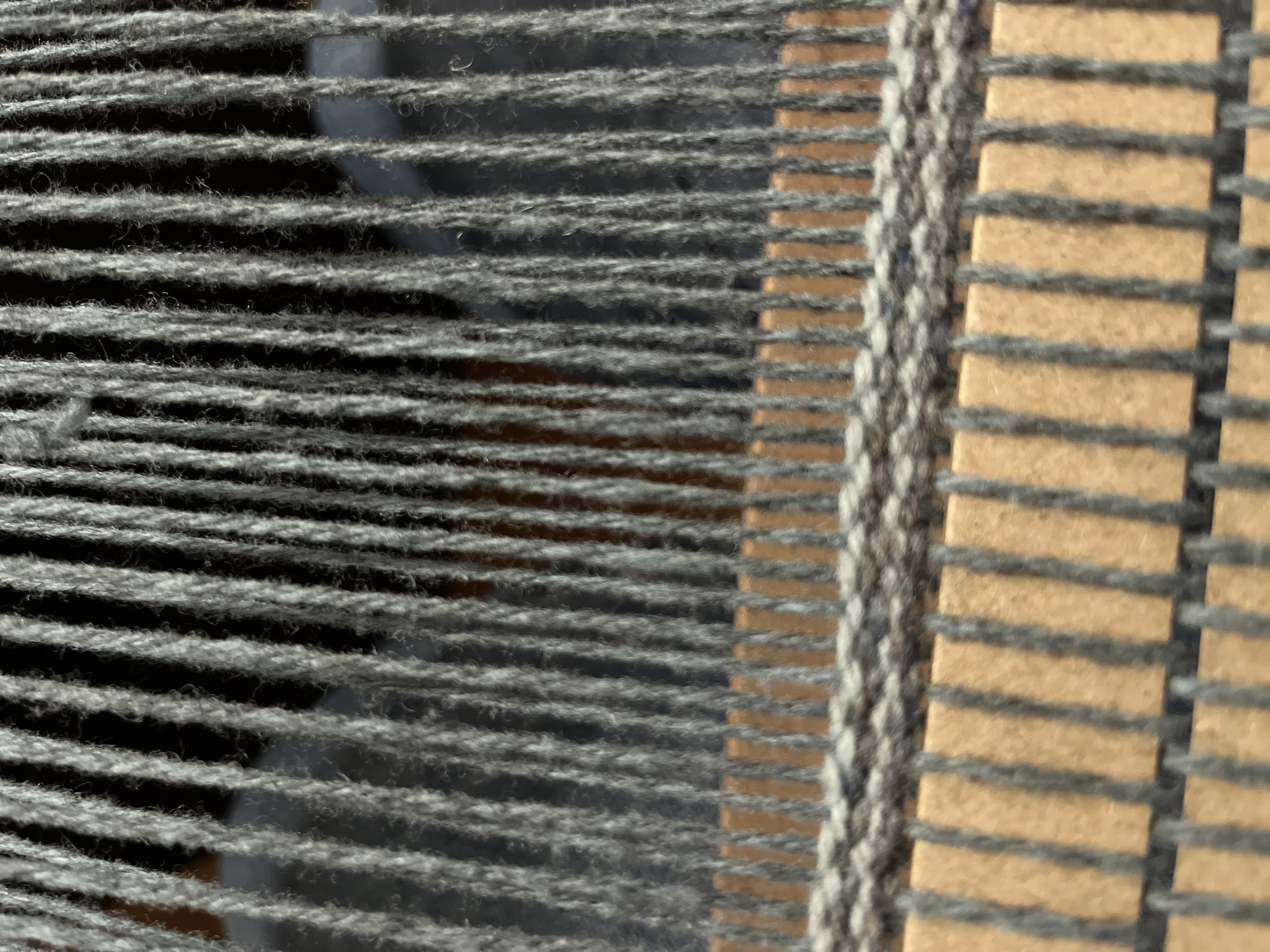 Photo of loom warped with a blue gray wool yarn.