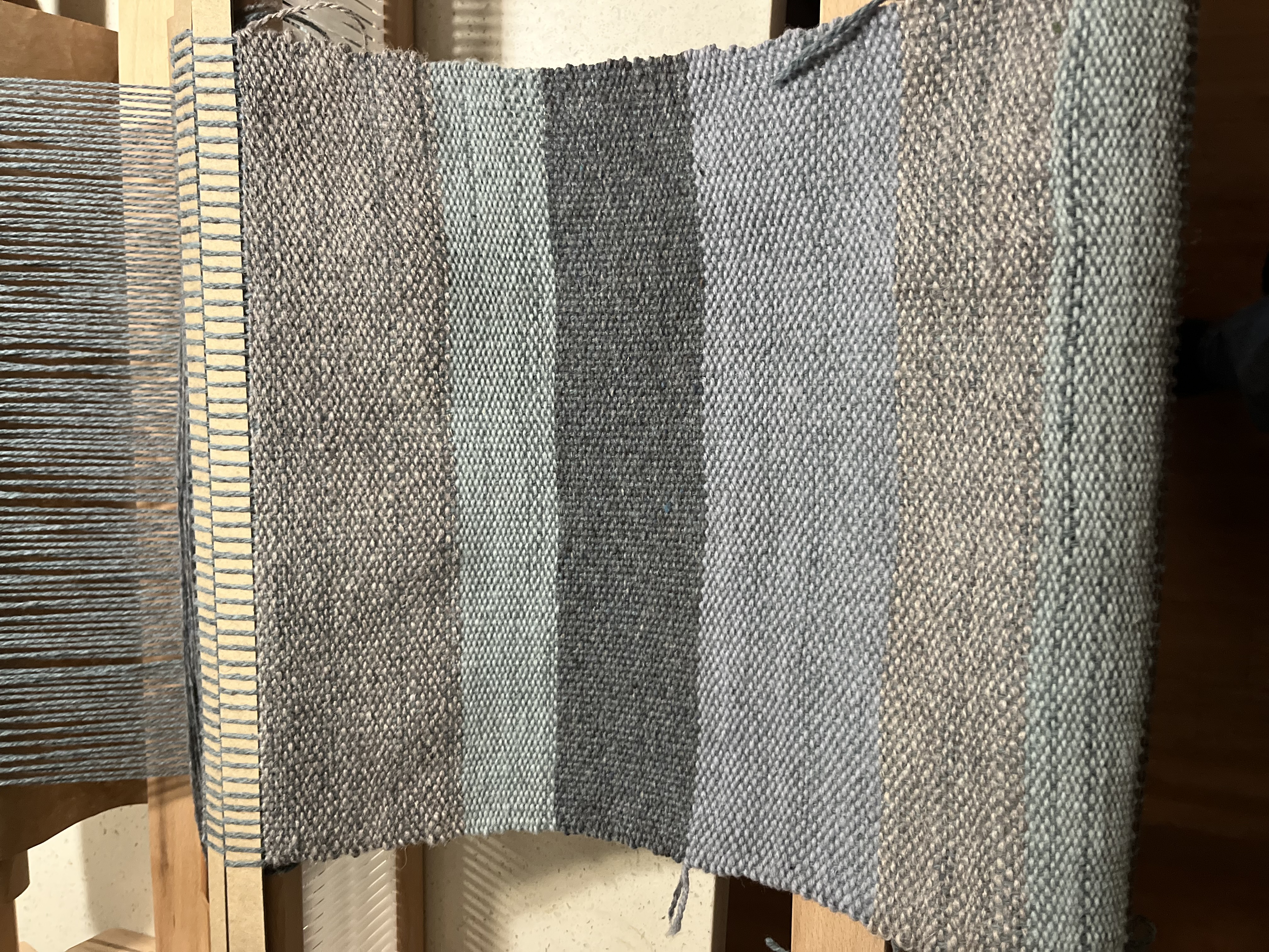 Photo of same loom with some progress on weaving.