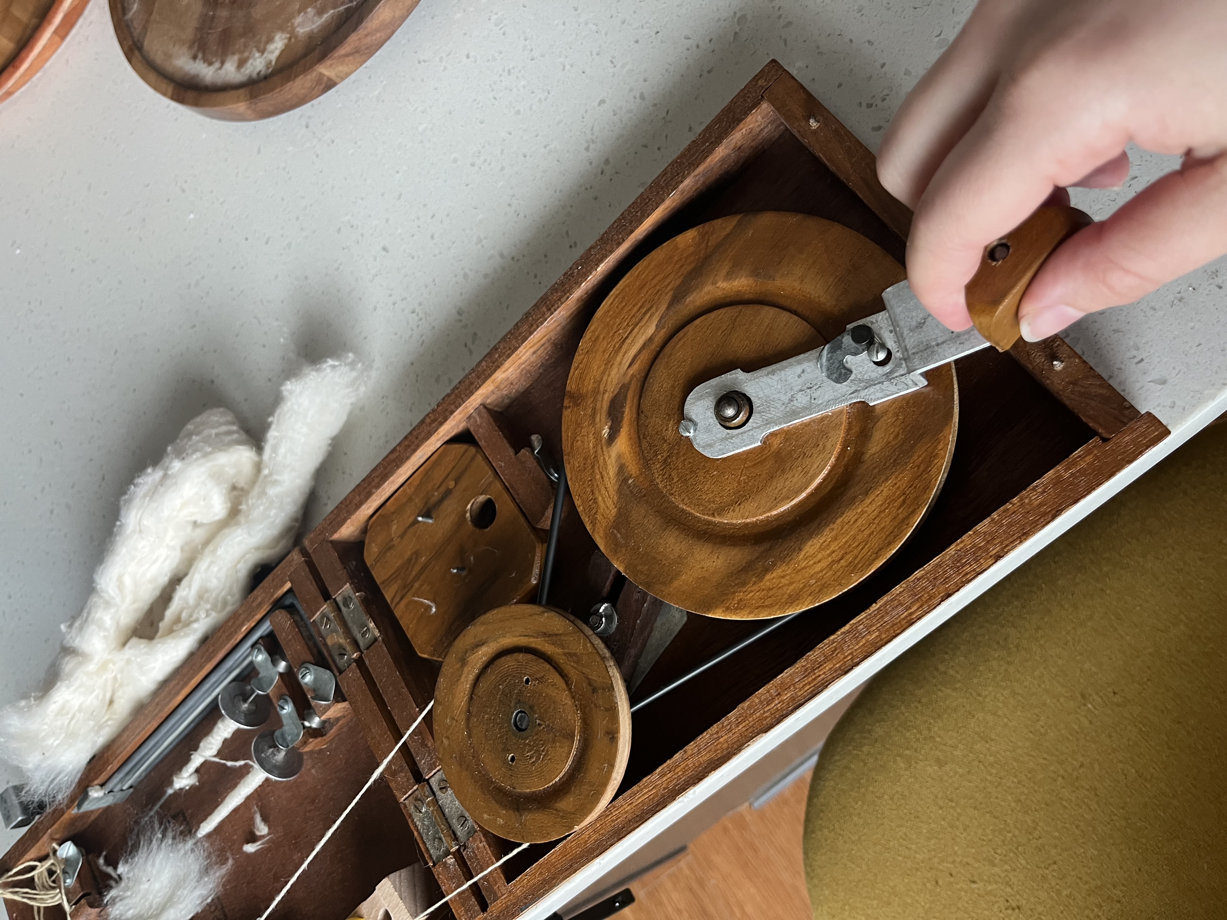 Spinning silk on a Charkha